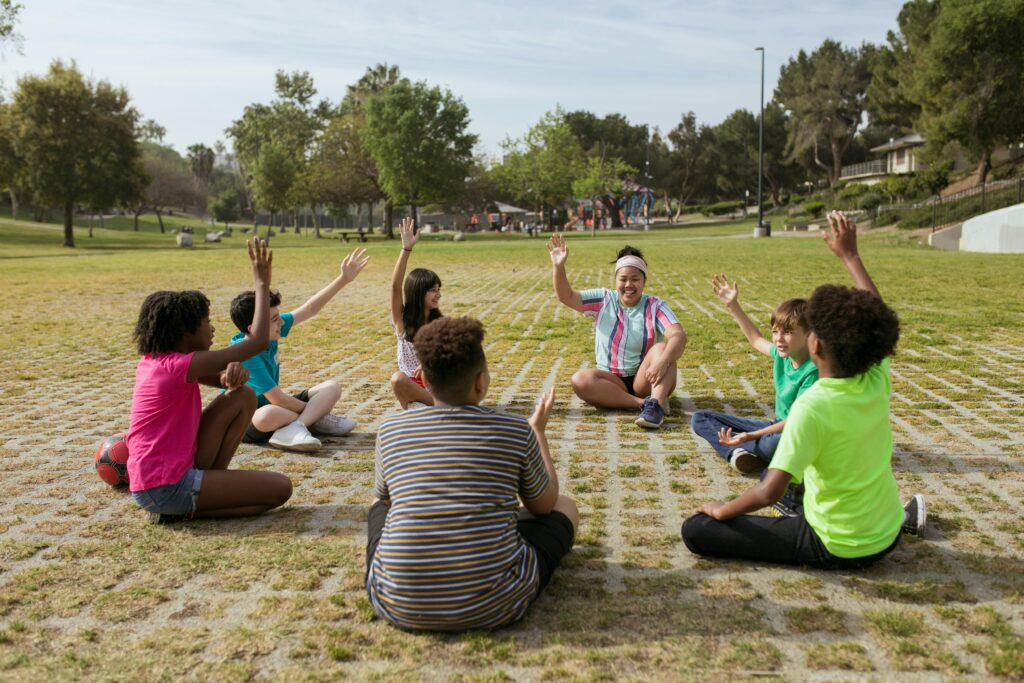 Children eagerly share thoughts while gathered in a circle