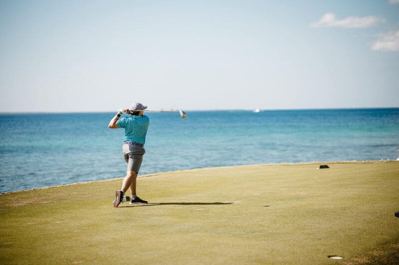 8. Playing Golf at Prestigious Clubs