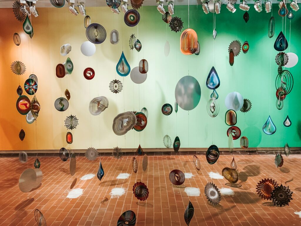 assorted balloons on white wall